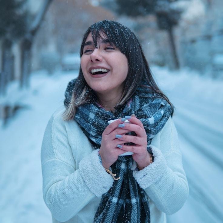 Kaveri Mehta, Lead Design Curator at SoftFieldGrove, reviewing corporate floral arrangements